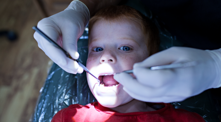 A young child at a dental cleaning appointment.